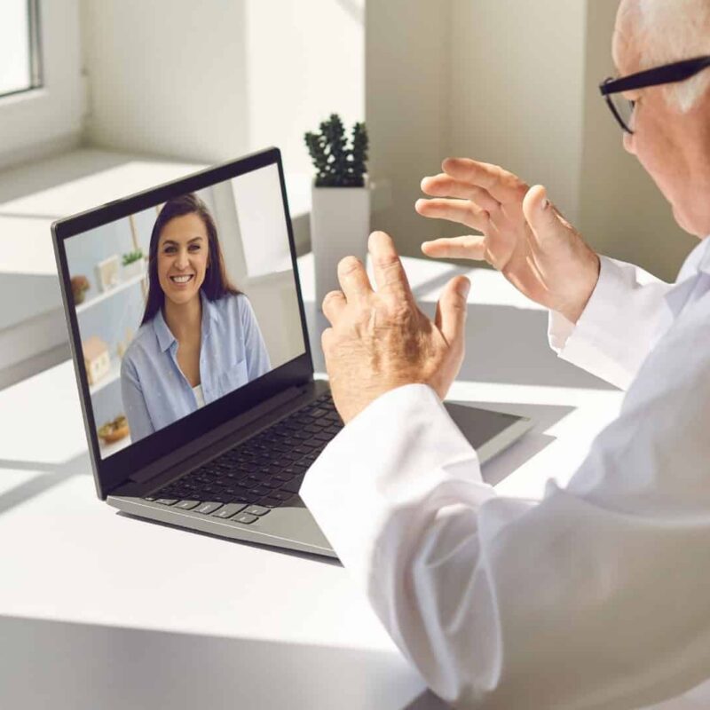 Doctor conducting a telehealth medical marijuana evaluation with a patient via video call